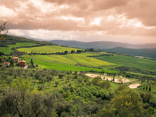 Obraz premium Hilly landscape at sunset.