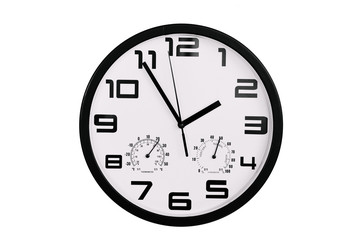 simple classic black and white round wall clock isolated on white. Clock with arabic numerals on wall shows 13:55 , 1:55