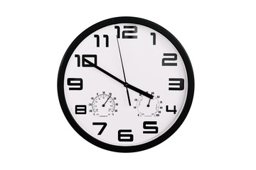 simple classic black and white round wall clock isolated on white. Clock with arabic numerals on wall shows 15:50 , 3:50