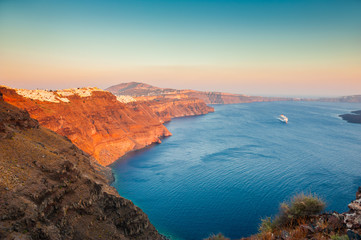 Beautiful sunset on Santorini island, Greece. Famous travel destination. Summer landscape, sea view