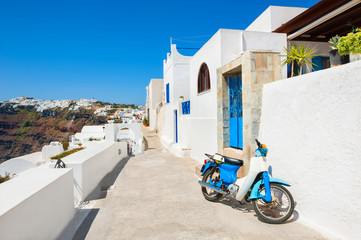 Beautiful street with white architecture on Santorini island, Greece. Famous travel destination