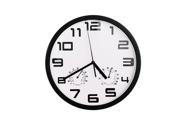 simple classic black and white round wall clock isolated on white. Clock with arabic numerals on wall shows 16:40 , 4:40