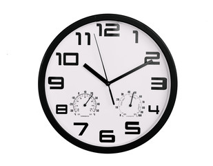 simple classic black and white round wall clock isolated on white. Clock with arabic numerals on wall shows 10:10 , 22:10