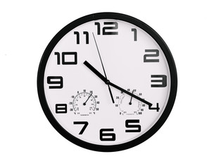simple classic black and white round wall clock isolated on white. Clock with arabic numerals on wall shows 10:20 , 22:20