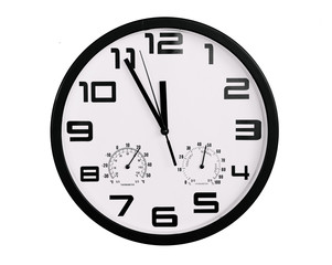 simple classic black and white round wall clock isolated on white. Clock with arabic numerals on wall shows 11:55 , 23:55