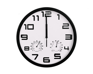 simple classic black and white round wall clock isolated on white. Clock with arabic numerals on wall shows 12:00 , 00:00