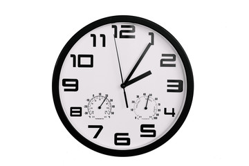 simple classic black and white round wall clock isolated on white. Clock with arabic numerals on wall shows 2:05 , 14:05