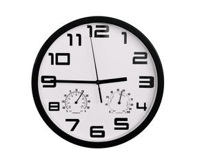simple classic black and white round wall clock isolated on white. Clock with arabic numerals on wall shows 2:45 , 14:45