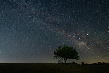 Naklejka na ściany i meble Night landscape with Milky Way near Malpartida de Caceres. Extremadura. Spain.