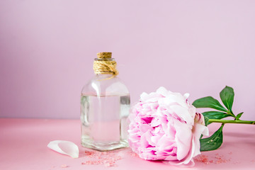 Floral natural organic cosmetics on pink background