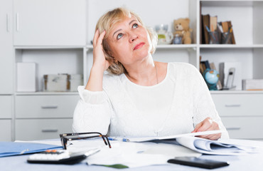 Woman engaged in home accounting