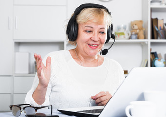 Mature woman communicates via the Internet