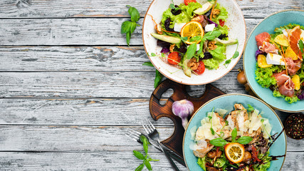 A set of salads. In the plate. Rustic style. Top view. Free space for your text.
