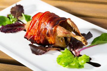 Wrapped in bacon baked quail