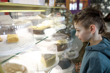 Kid choosing cake