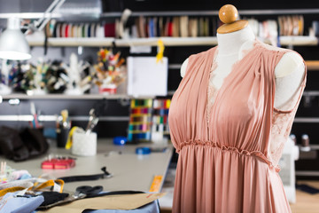 Image of workplace of designer with mannequin