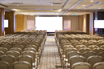 Rows of chairs in a conference room
