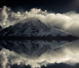 Mountain peaks of Torres del Paine in Patagonia National Park Chile.  Photoshop reflection of peaks with black and white filter