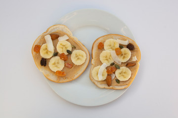 Peanut butter sandwich breakfast or snack on white background.