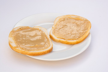 Peanut butter sandwich breakfast or snack on white background.