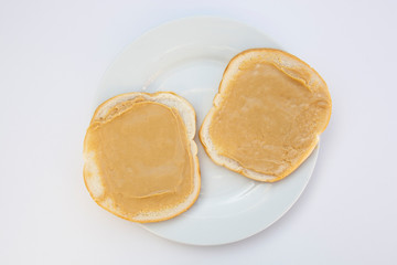 Peanut butter sandwich breakfast or snack on white background.