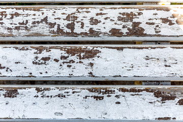 Old wooden boards with peeling paint, background.