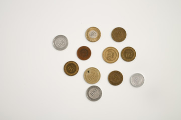 coins of different countries close-up on a white background