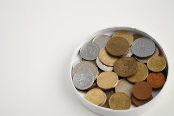 coins of different countries close-up on a white background