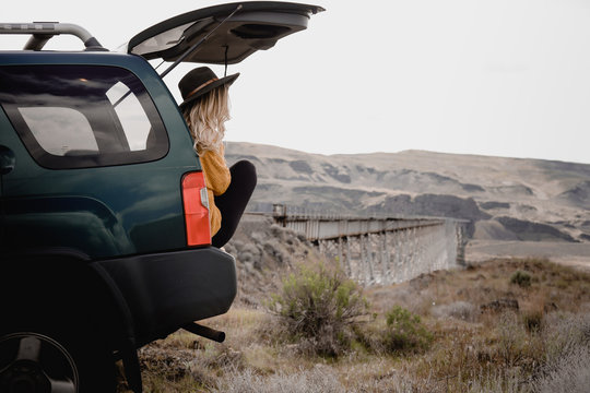 woman sitting in vehicle