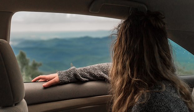 Woman Sitting Inside Car