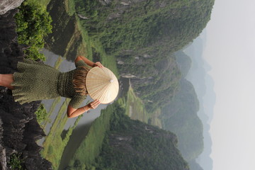 woman standing near mountain poster