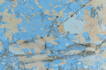 Fototapeta premium background of a shabby old wall painted in yellow and blue