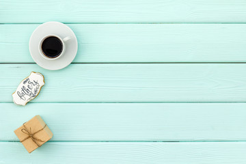 design for Father Day celebration party with gift box and coffee on mint green background top view mock up