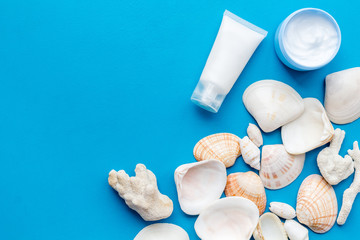 Dead Sea cosmetics with natural ingredients on blue table background top view space for text