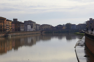Fototapeta na wymiar Arno river in Pisa - city in Italy's Tuscany region 