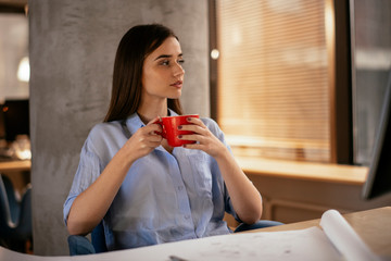 Businesswoman having a coffee break