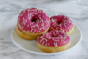 Donaltsa donuts with pink icing