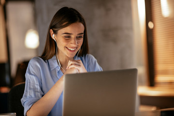 Businesswoman in having a video call on laptop. - obrazy, fototapety, plakaty