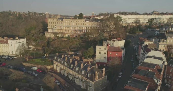 Bristol Cityscape: Aerial tracking past residential houses in Clifton over the Avon Gorge and the iconic Clifton Suspension Bridge