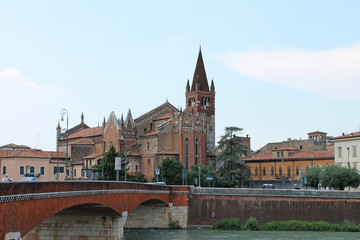 Obraz premium Verona old town in Italy with historical architecture and the river on a clear summer day