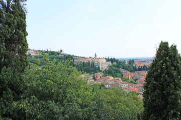 Fototapeta na wymiar Panorama of Verona Italy with a view of the red roofs of the old town and the tower