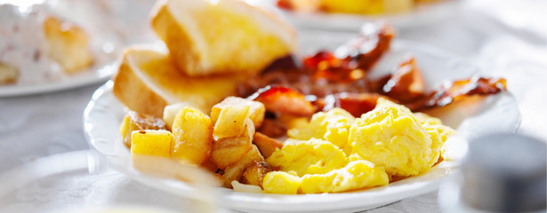 breakfast with eggs bacon and hashbrowns panorama - Powered by Adobe