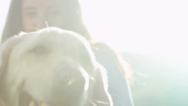 close up of young girl with dog