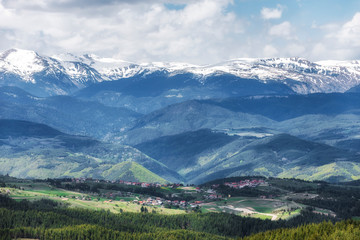 Fototapeta na wymiar Snowy hills of Rila mountain in Bulgaria during spring, Photo from Rhodope