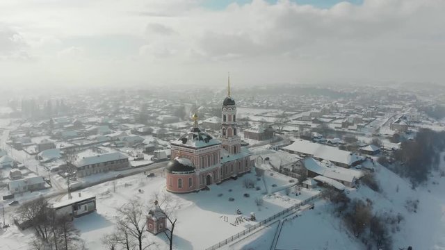flight over the church near the  Kama river in winter