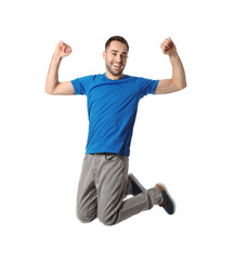 Full length portrait of happy handsome man jumping on white background