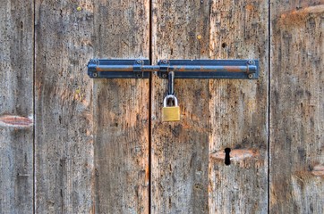 background of old wooden door with padlock