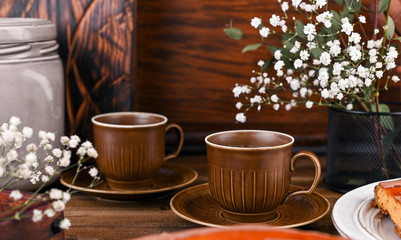 Obraz na płótnie Canvas Cups for tea in vintage style with elements of decor. Wooden background and dishes.