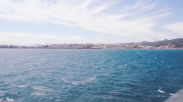 Ceuta, Spain View from speed boat crossing blue waters of Gibraltar strait towards North African shores on clear sky weather - Ceuta is entry point for illegal Sub Saharan migrants to EU