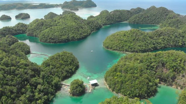 Aerial drone tracking shot of tropical islands, lagoons, and turquoise  waters at Siargao Island, Surigao del Norte
Philippines